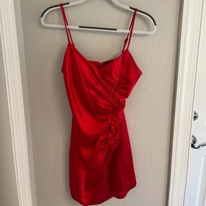 Red Olivaceous mini dress with sinched side, small slit at bottom